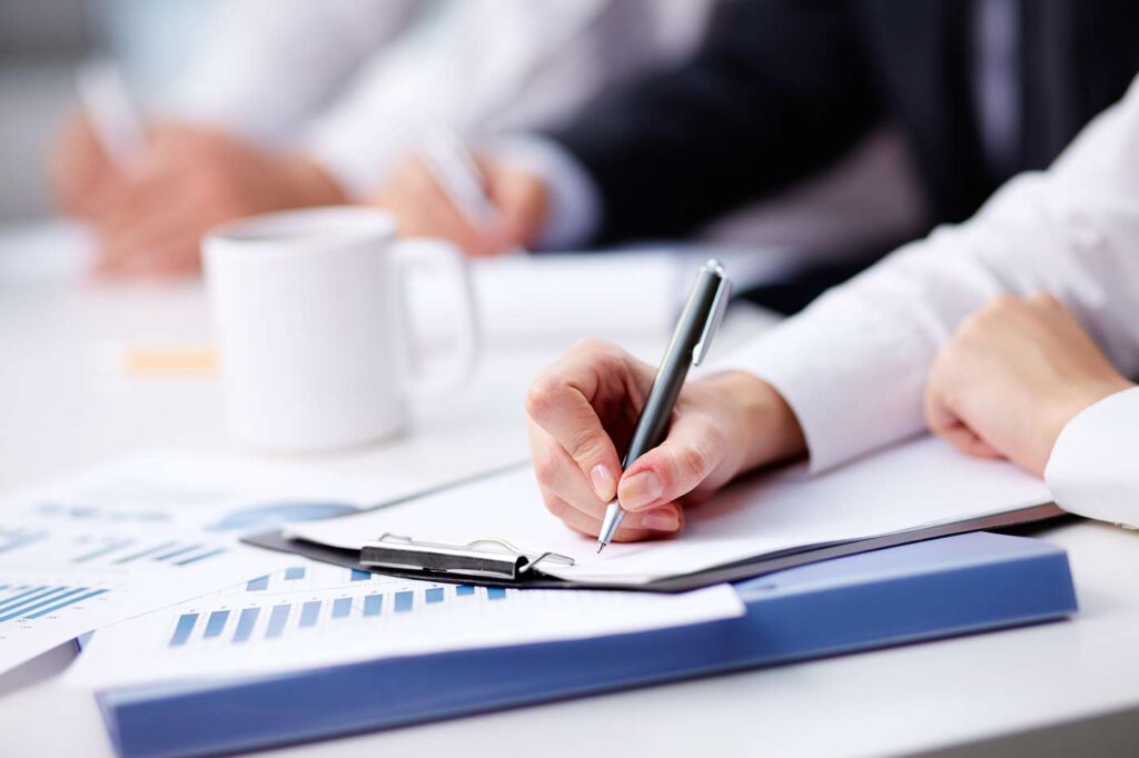 Woman Holding a pen and writing a plan