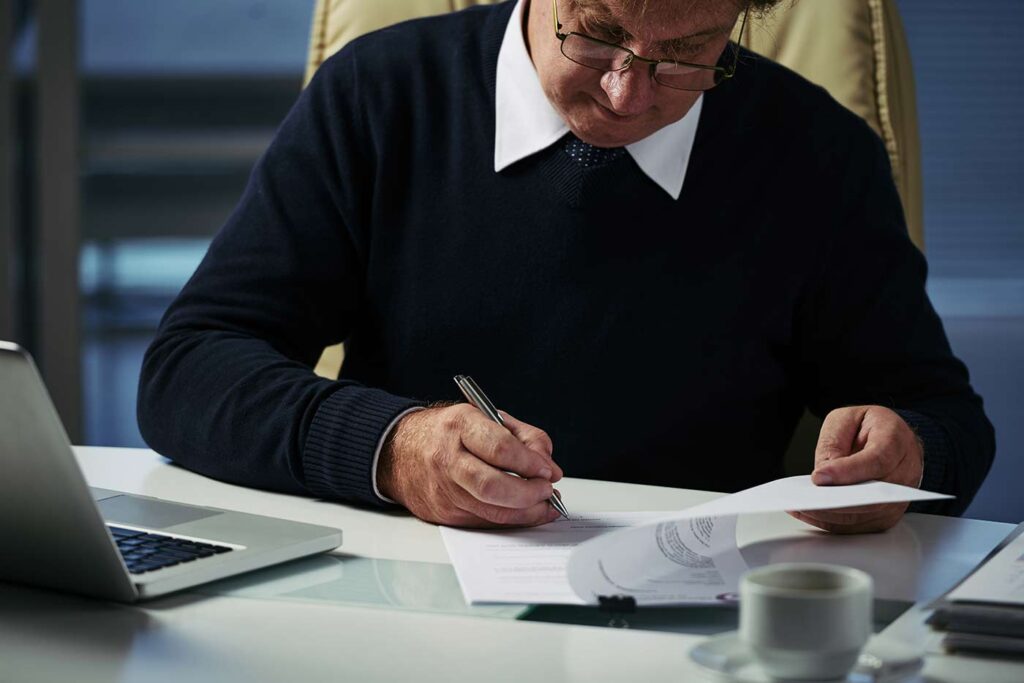 Probate Attorney signing document